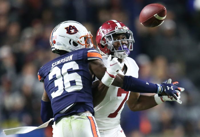 Nov 27, 2021; Auburn, Alabama, USA; Auburn Tigers defensive back Jaylin Simpson (36) breaks up a pass intended for Alabama Crimson Tide wide receiver Ja'Corey Brooks (7) at Jordan-Hare Stadium. Alabama defeated Auburn in four overtimes. Mandatory Credit: Gary Cosby Jr.-USA TODAY Sports